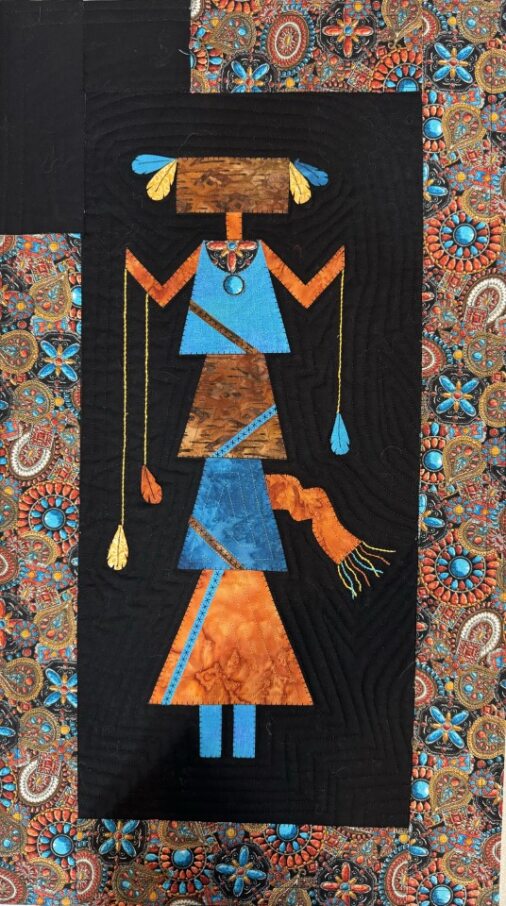 Arlene Walsh southwest pattern and fabric kit features spirit dancer, rattles, feathers, applique, pieced border. Kit material will differ from pattern photo - please view back of package for fabric selection.