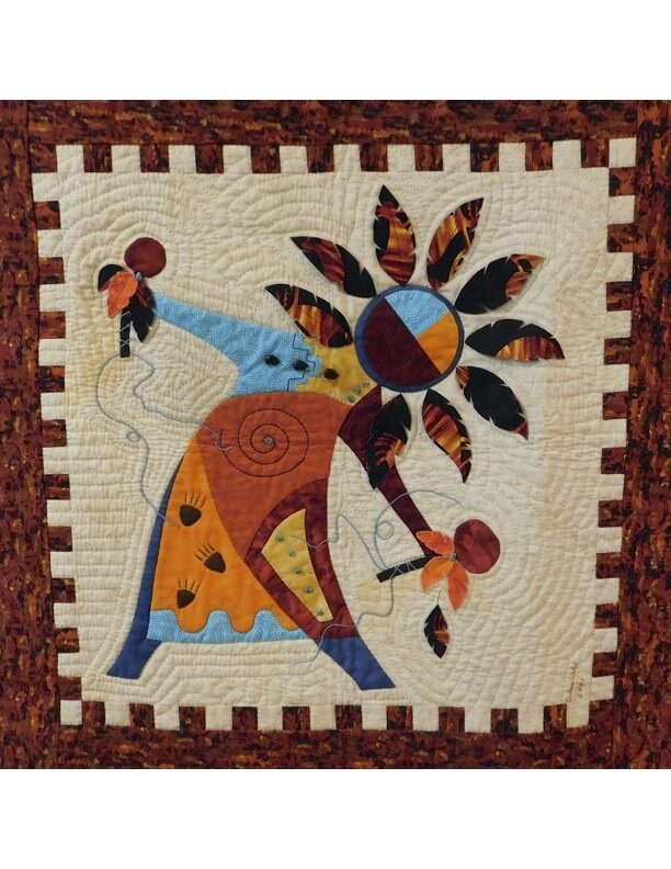 Arlene Walsh southwest pattern and fabric kit features spirit dancer, rattles, feathers, applique, pieced border. Kit material will differ from pattern photo.